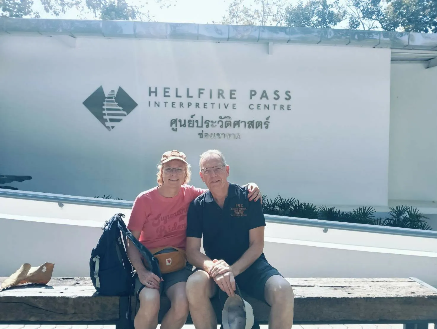 A couple on the bench at the Hellfire Pass Interpretive Centre